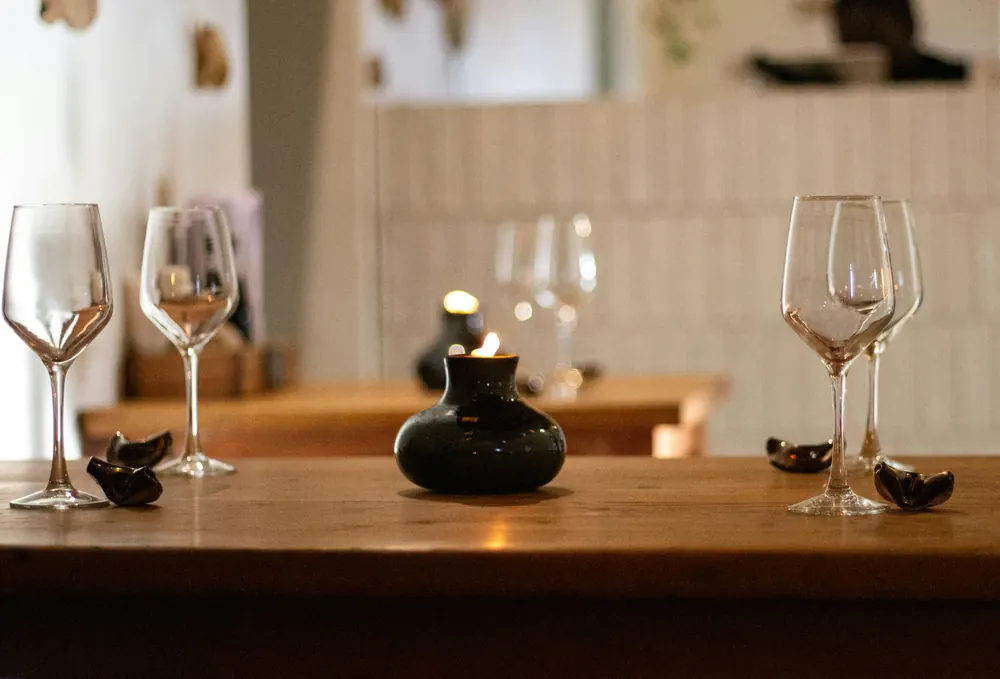 Wine glasses by candlelight at an intimate table