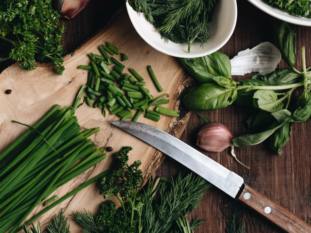 Seasonal herbs and garlic prepared by hand