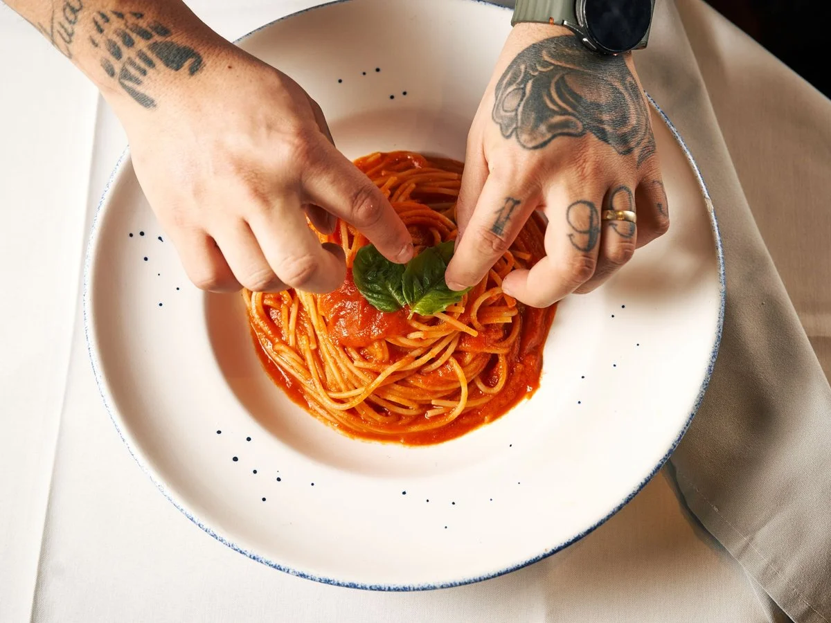 Chef plating a signature dish